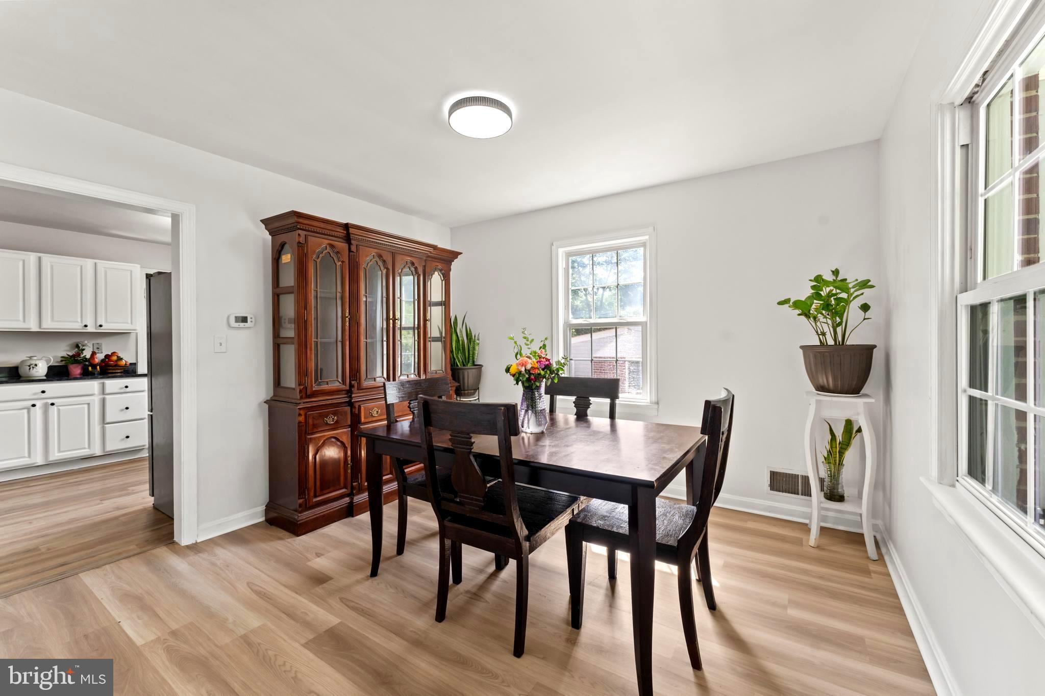 9307 Biltmore Drive Silver Spring, MD 20901 - Photo 6 of 33 a view of a dining room with furniture and a window