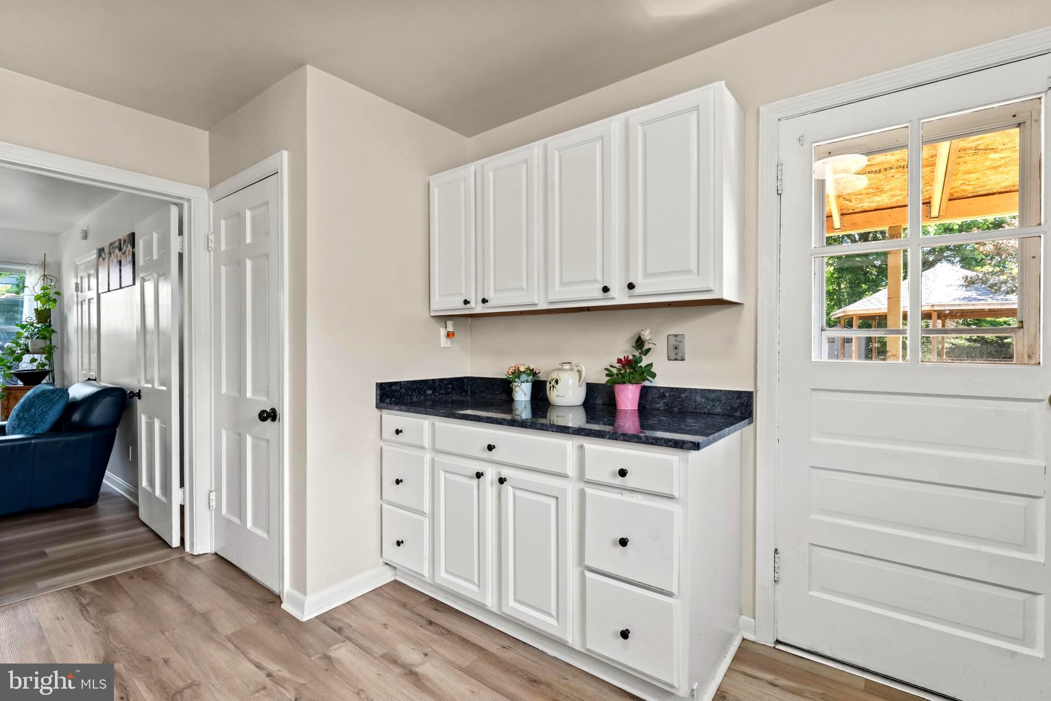 9307 Biltmore Drive Silver Spring, MD 20901 - Photo 10 of 33 a kitchen with granite countertop white cabinets and window