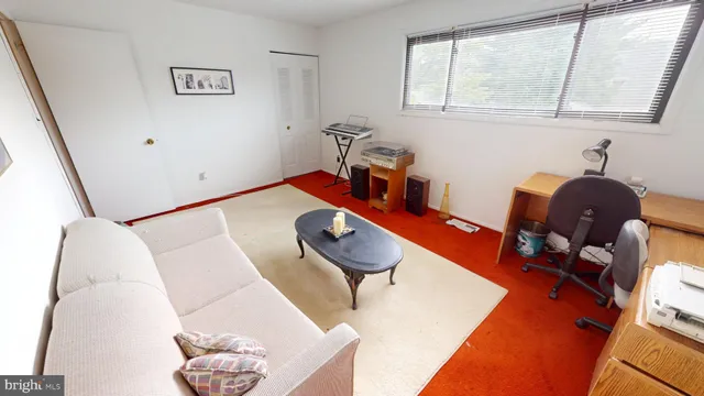 a room with furniture and wooden floor