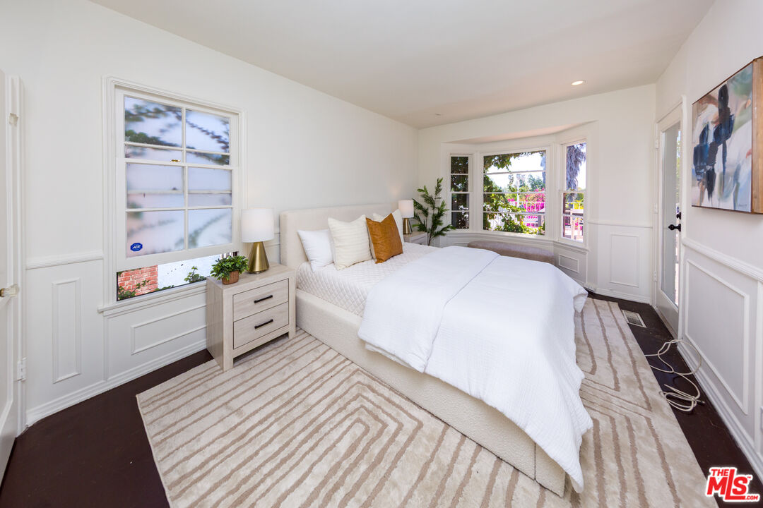 1904 Preuss Road Los Angeles, CA 90034 - Photo 14 of 32 a bed room with a bed mirror and a window