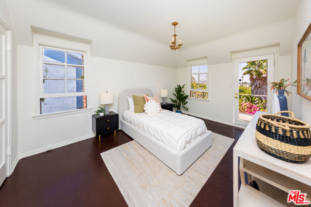 1904 Preuss Road Los Angeles, CA 90034 - Photo 16 of 32 a bedroom with a bed and a window