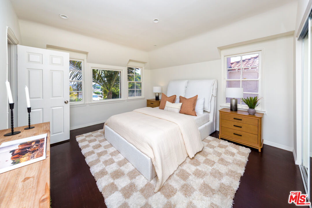 1904 Preuss Road Los Angeles, CA 90034 - Photo 20 of 32 a bedroom with a bed and wooden floor