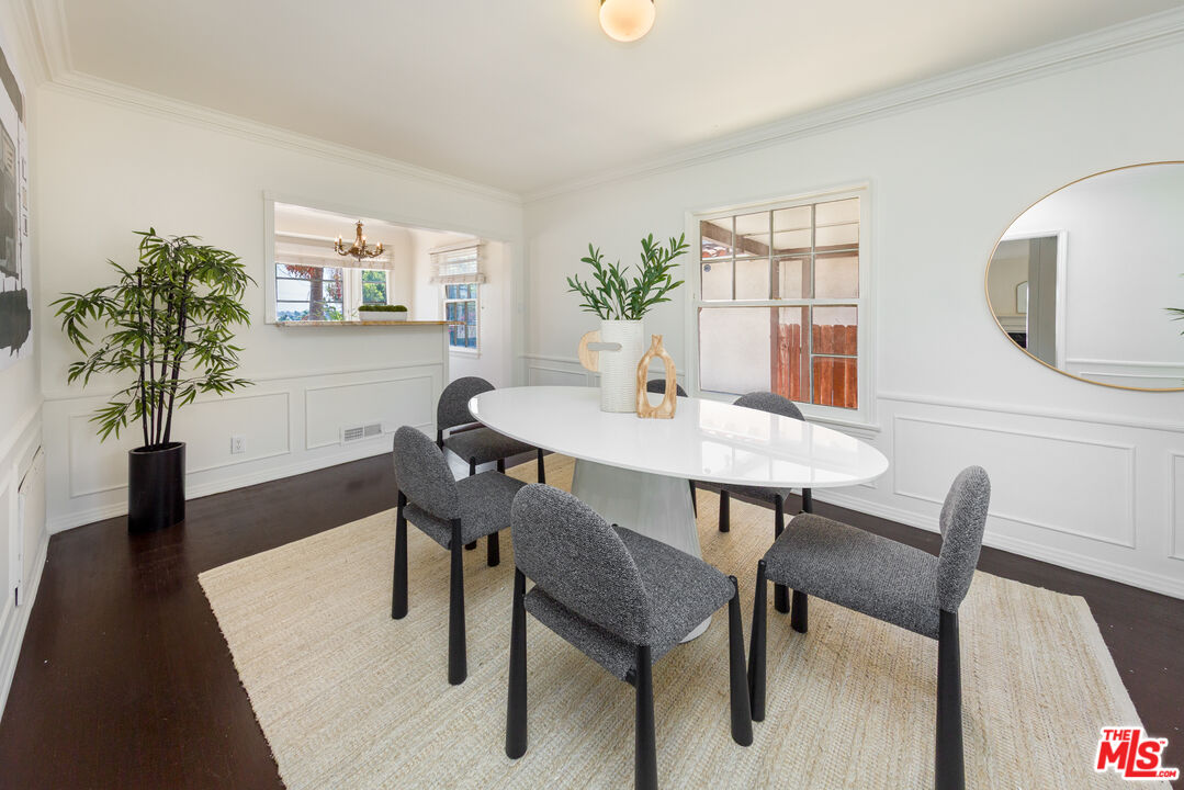 1904 Preuss Road Los Angeles, CA 90034 - Photo 2 of 32 a view of a dining room with furniture and wooden floor