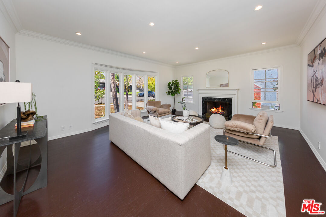 1904 Preuss Road Los Angeles, CA 90034 - Photo 4 of 32 a living room with furniture fireplace and a large window