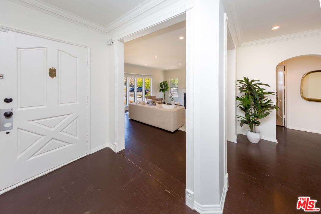 1904 Preuss Road Los Angeles, CA 90034 - Photo 5 of 32 a view of a hallway with dining room and wooden floor