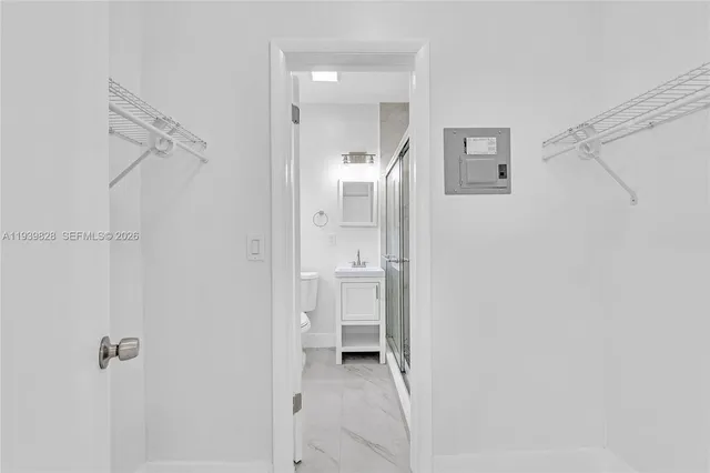 a bathroom with a shower and a toilet