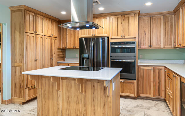 6233 West Airport Road Willcox, AZ 85643 - Photo 19 of 54 a kitchen with stainless steel appliances kitchen island granite countertop a refrigerator and a sink