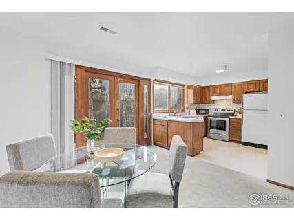 a living room with stainless steel appliances kitchen island granite countertop furniture and a kitchen view