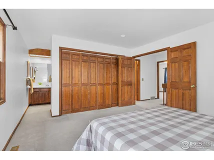 a bedroom with a bed and a area