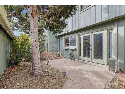 a backyard of a house with yard and outdoor seating