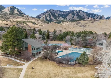 a view of a town with mountains in the background