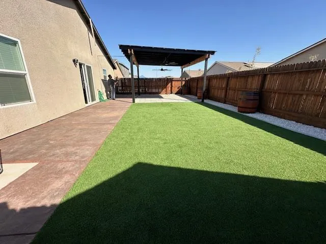 a view of a backyard with furniture