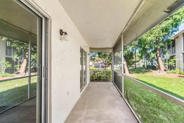 a view of a porch and garden