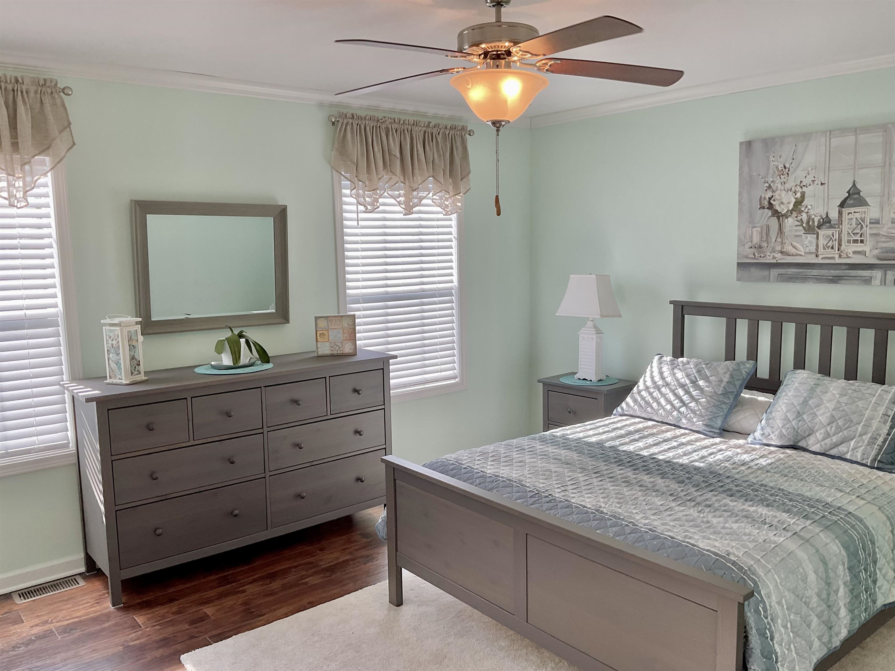 2058 Shore Road Seaville, NJ 08230 - Photo 22 of 36 a bedroom with a bed and a chandelier