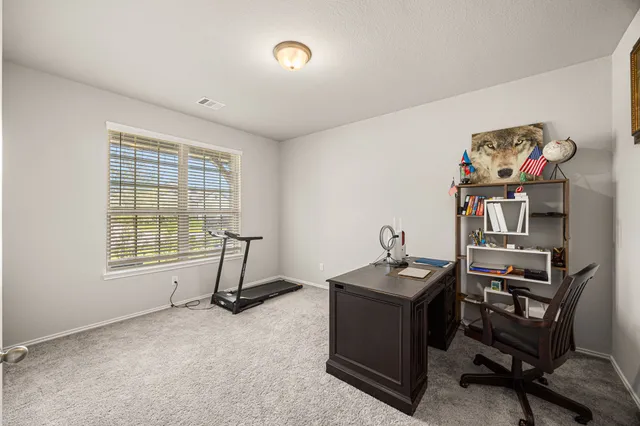 a room with furniture and a window