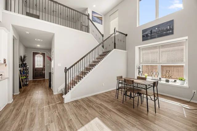 a view of a dining room with furniture window and wooden floor