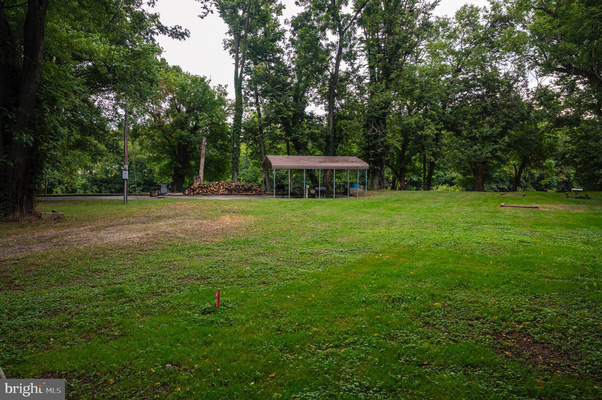 30 Burma Road Front Royal, VA 22630 - Photo 10 of 39 a backyard of a house with lots of green space and fountain