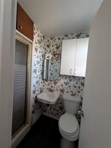 a bathroom with a toilet and a sink