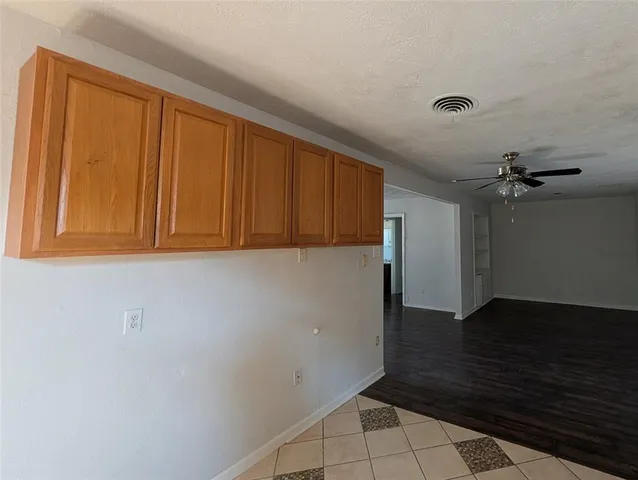 an empty room with wooden floor