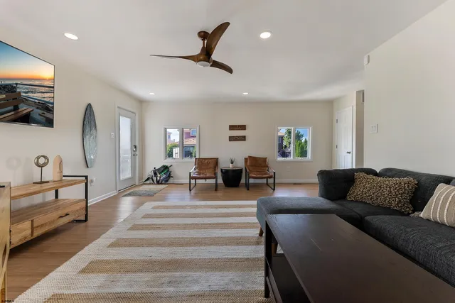 a view of room with hardwood floor and window