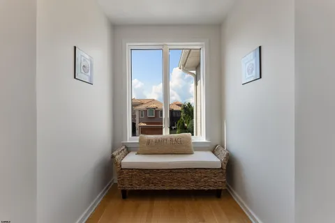 a spacious bedroom with a bed and ceiling fan