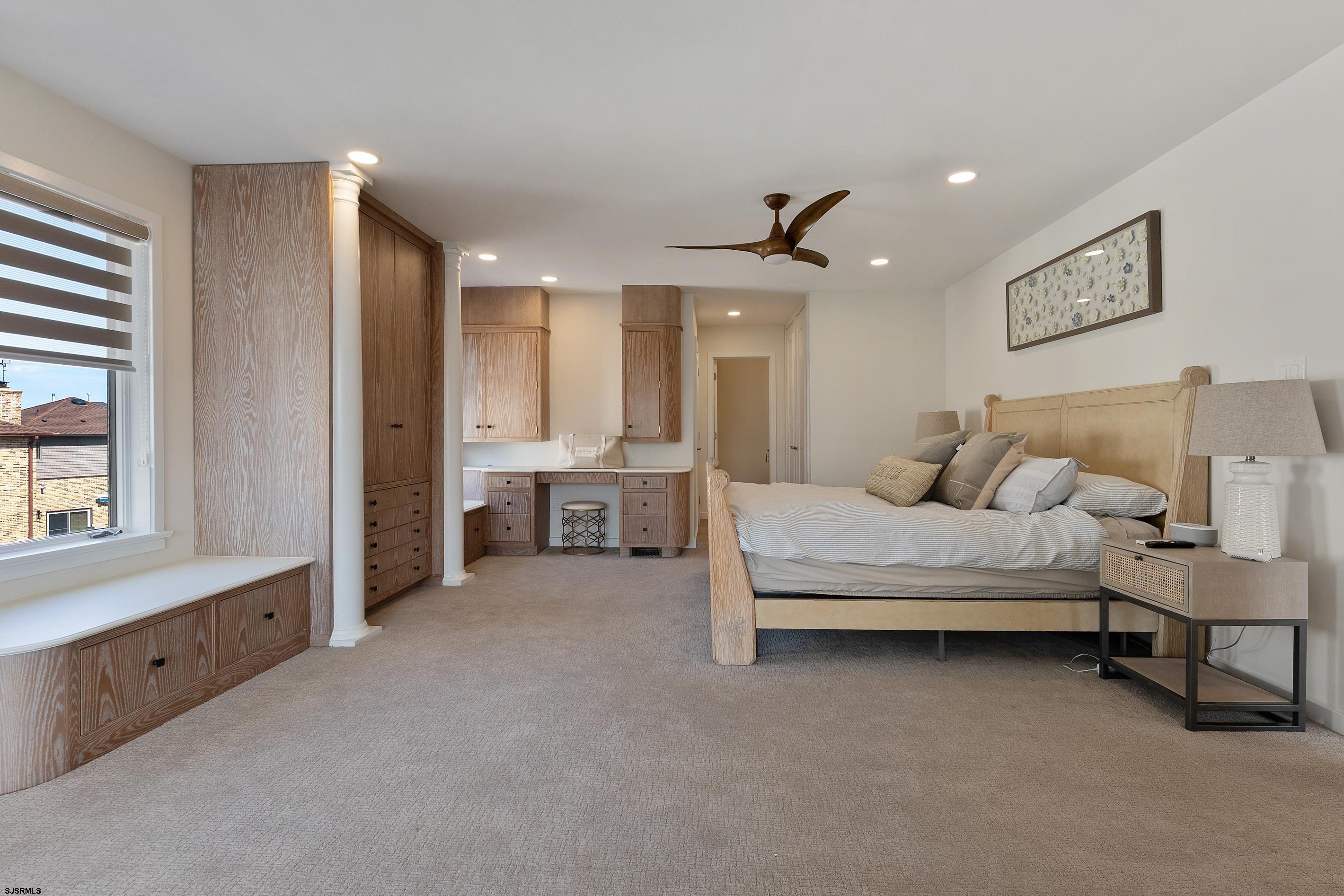 7600 Bayshore Drive, Unit SEPTEMBER 2026 Margate City, NJ 08402 - Photo 26 of 55 a spacious bedroom with a bed and a cabinets