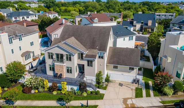 an aerial view of a house with a yard and garden