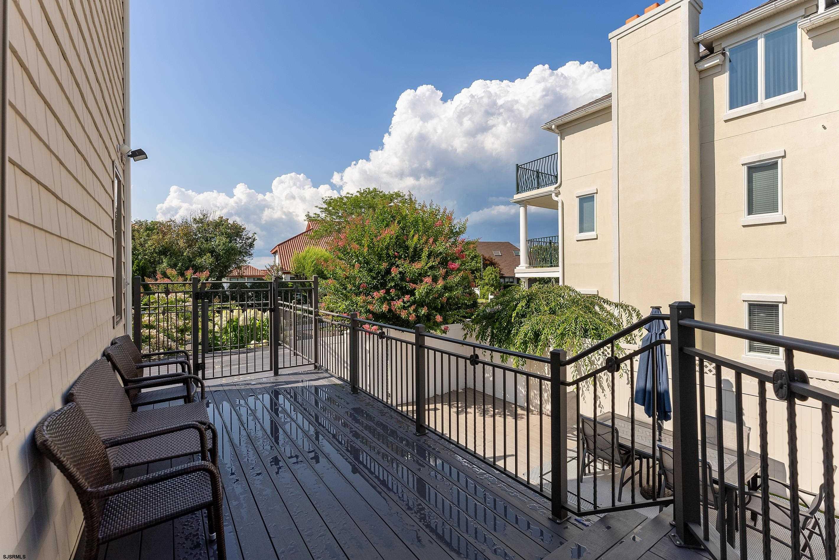 7600 Bayshore Drive, Unit SEPTEMBER 2026 Margate City, NJ 08402 - Photo 47 of 55 a view of a balcony with wooden floor