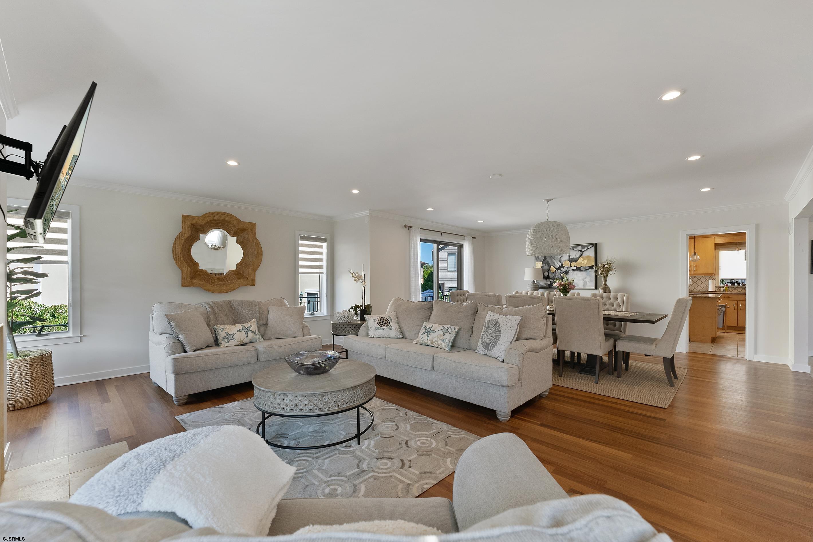 7600 Bayshore Drive, Unit SEPTEMBER 2026 Margate City, NJ 08402 - Photo 10 of 55 a living room with furniture and a large window