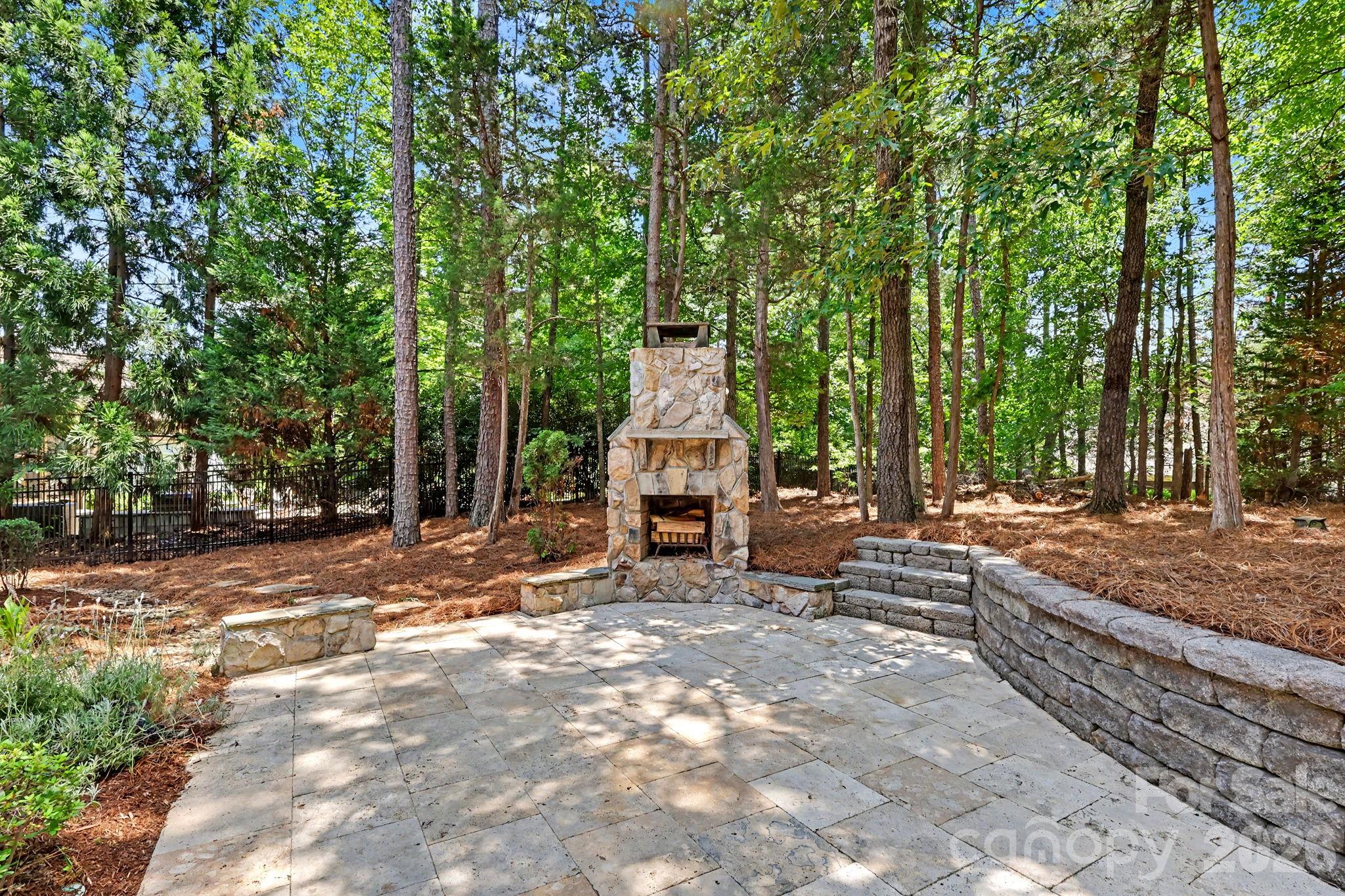508 Hideaway Ridge Court Matthews, NC 28105 - Photo 38 of 47 a view of a wooden bench sitting in the middle of a yard