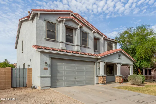 a bathroom with a sink toilet vanity and shower