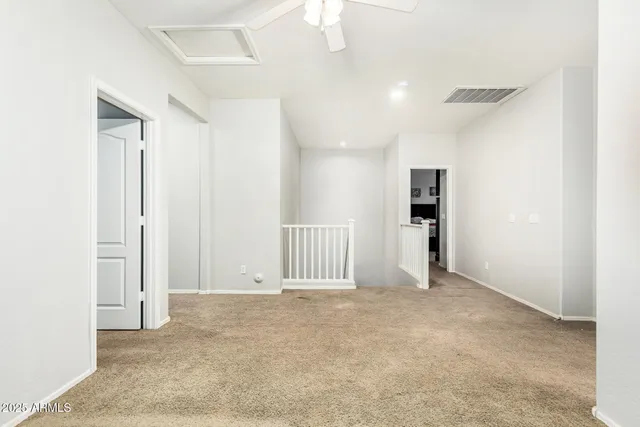 a view of a house with potted plants
