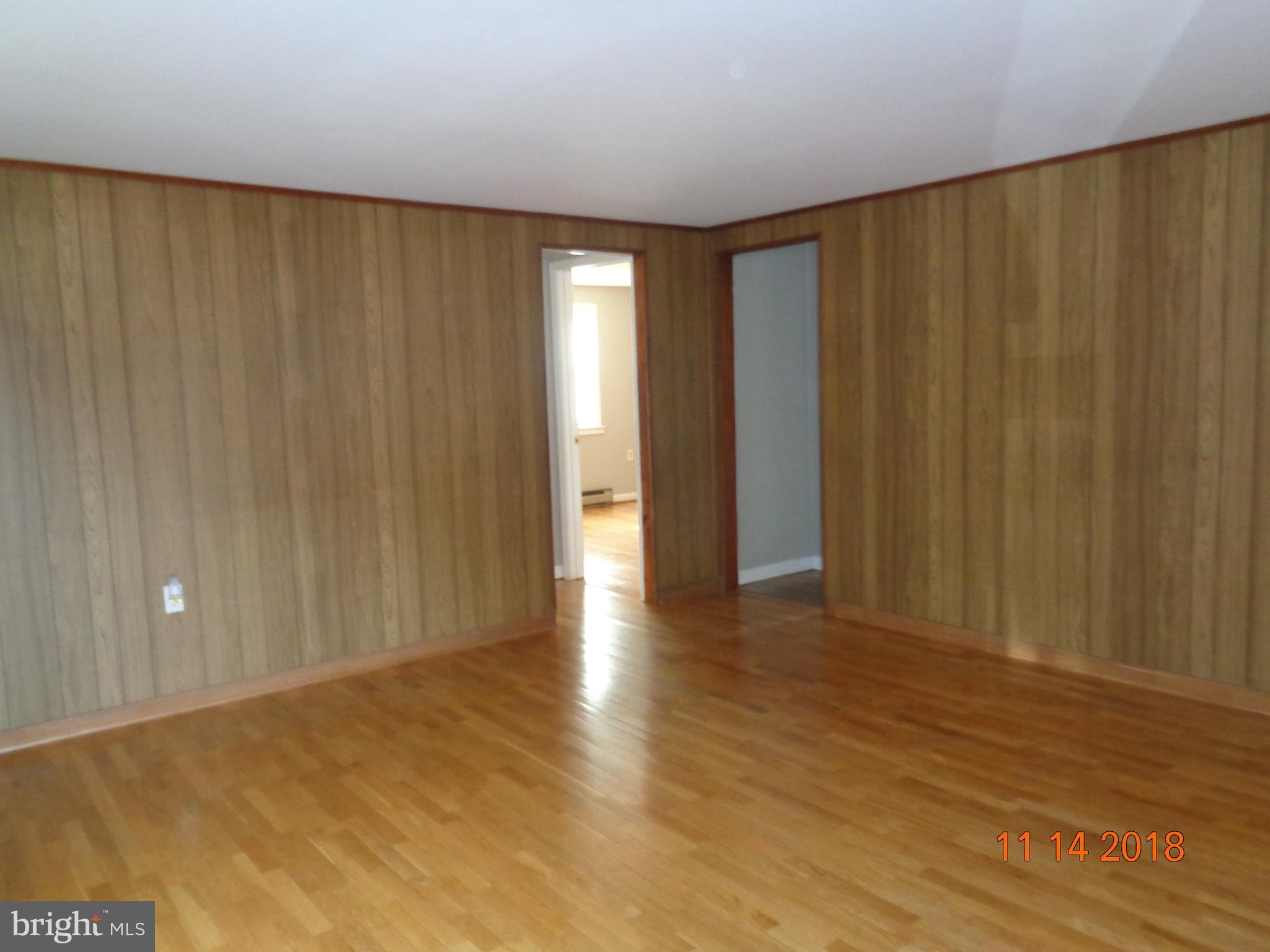 6335 Broomes Island Road St. Leonard, MD 20685 - Photo 3 of 32 Formal living room with beautiful hardwood floors