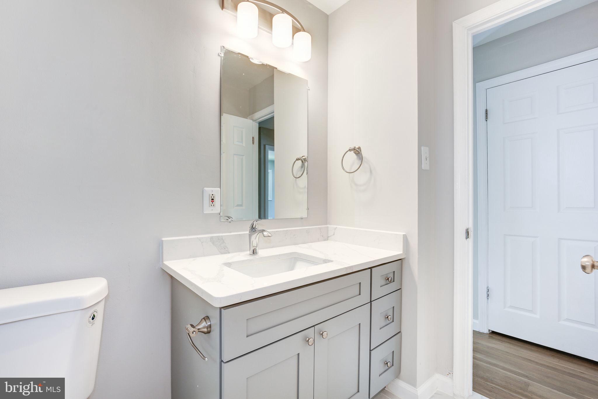 11830 Charles Road Silver Spring, MD 20906 - Photo 12 of 54 a bathroom with a sink and a toilet