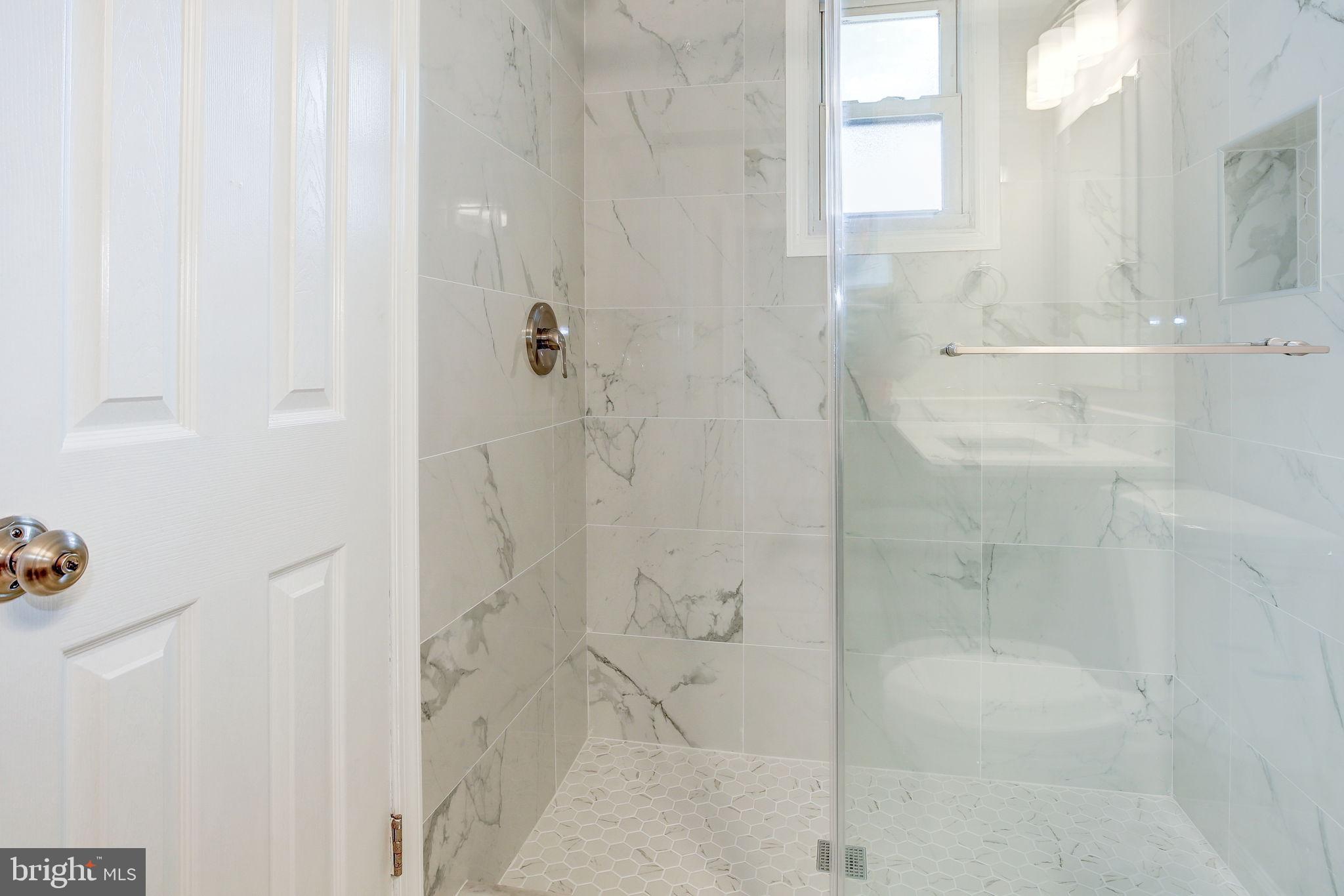 11830 Charles Road Silver Spring, MD 20906 - Photo 15 of 54 a bathroom with a shower