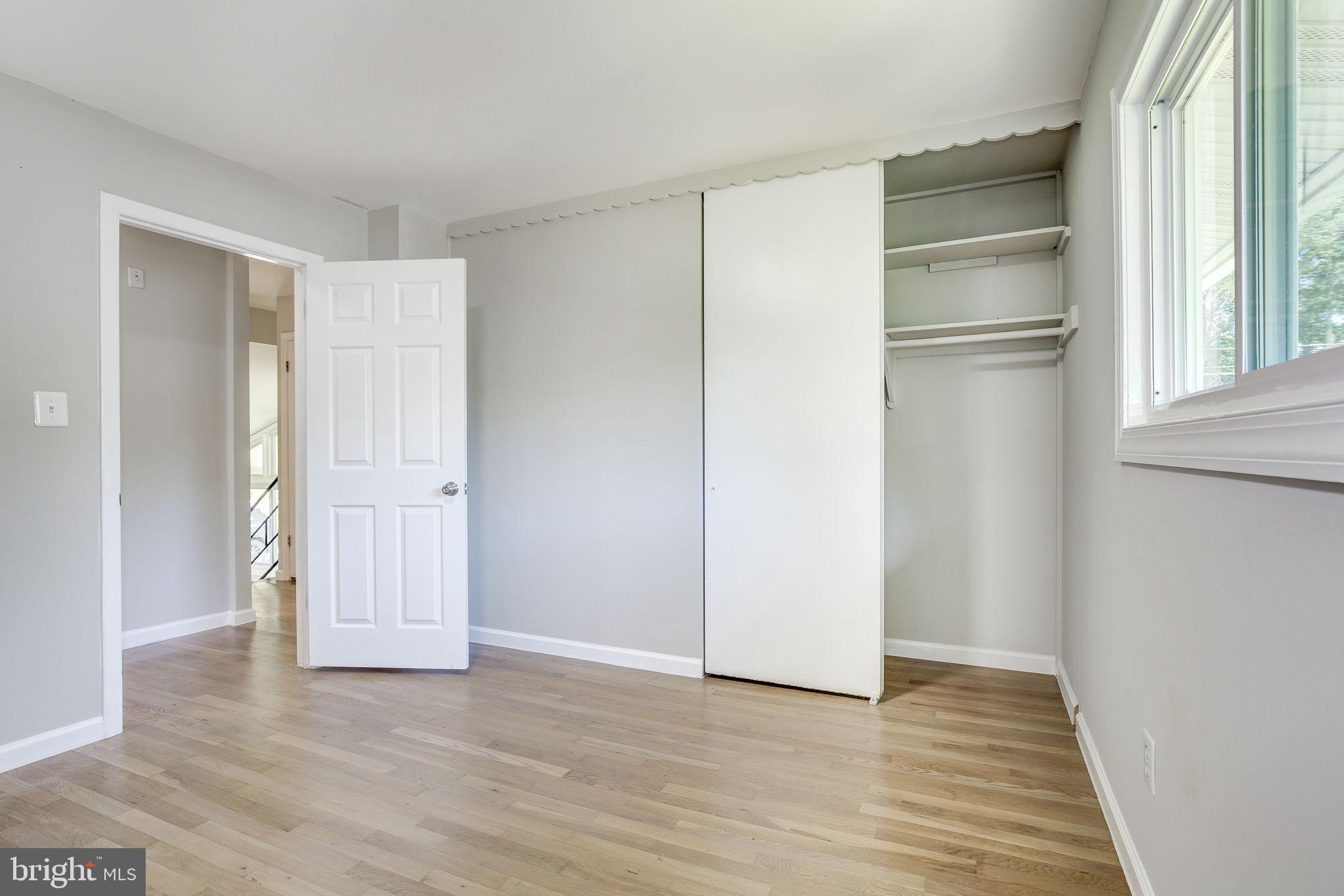 11830 Charles Road Silver Spring, MD 20906 - Photo 18 of 54 a view of an empty room with closet and wooden floor