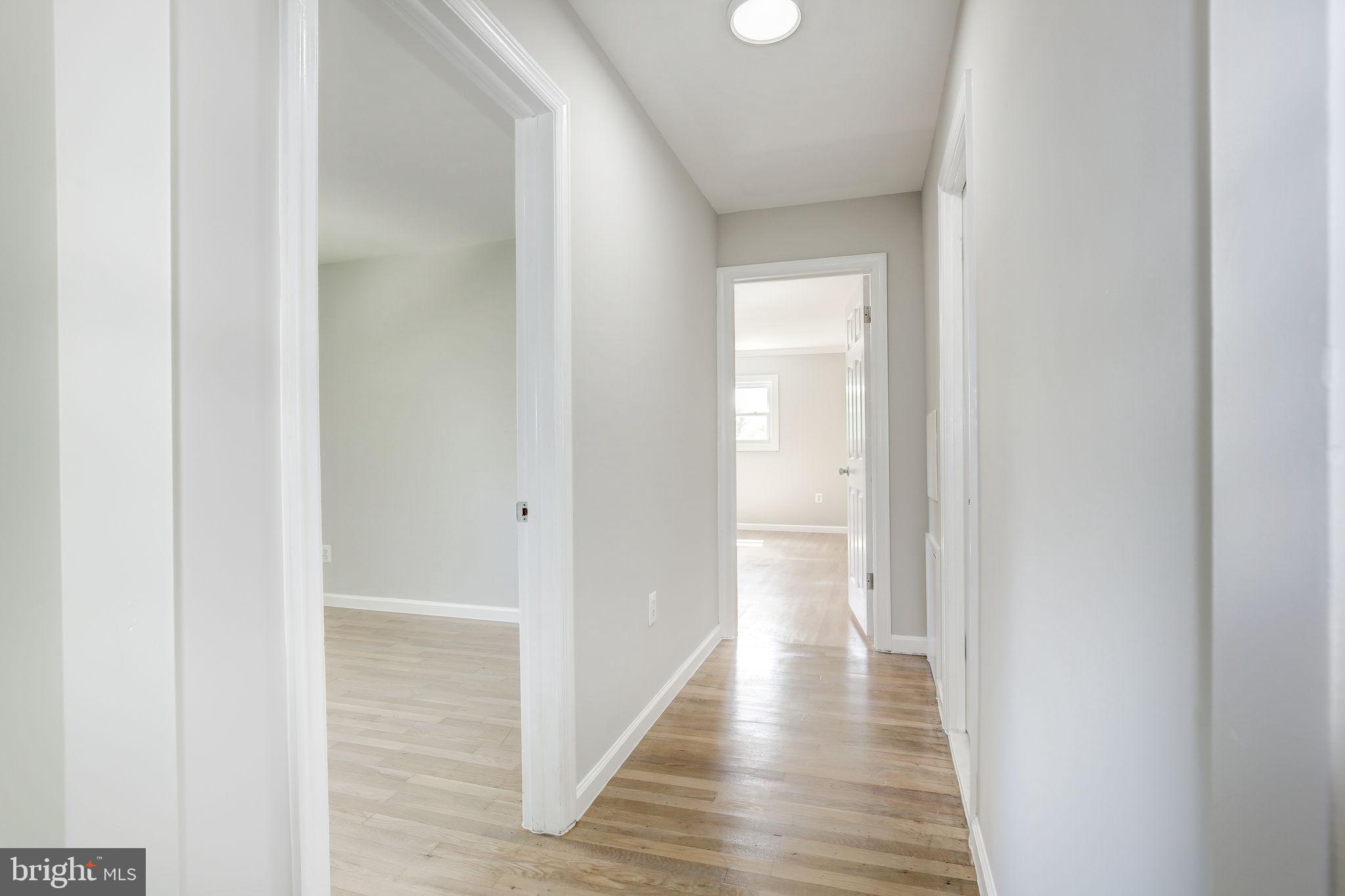 11830 Charles Road Silver Spring, MD 20906 - Photo 19 of 54 a view of a hallway with wooden floor