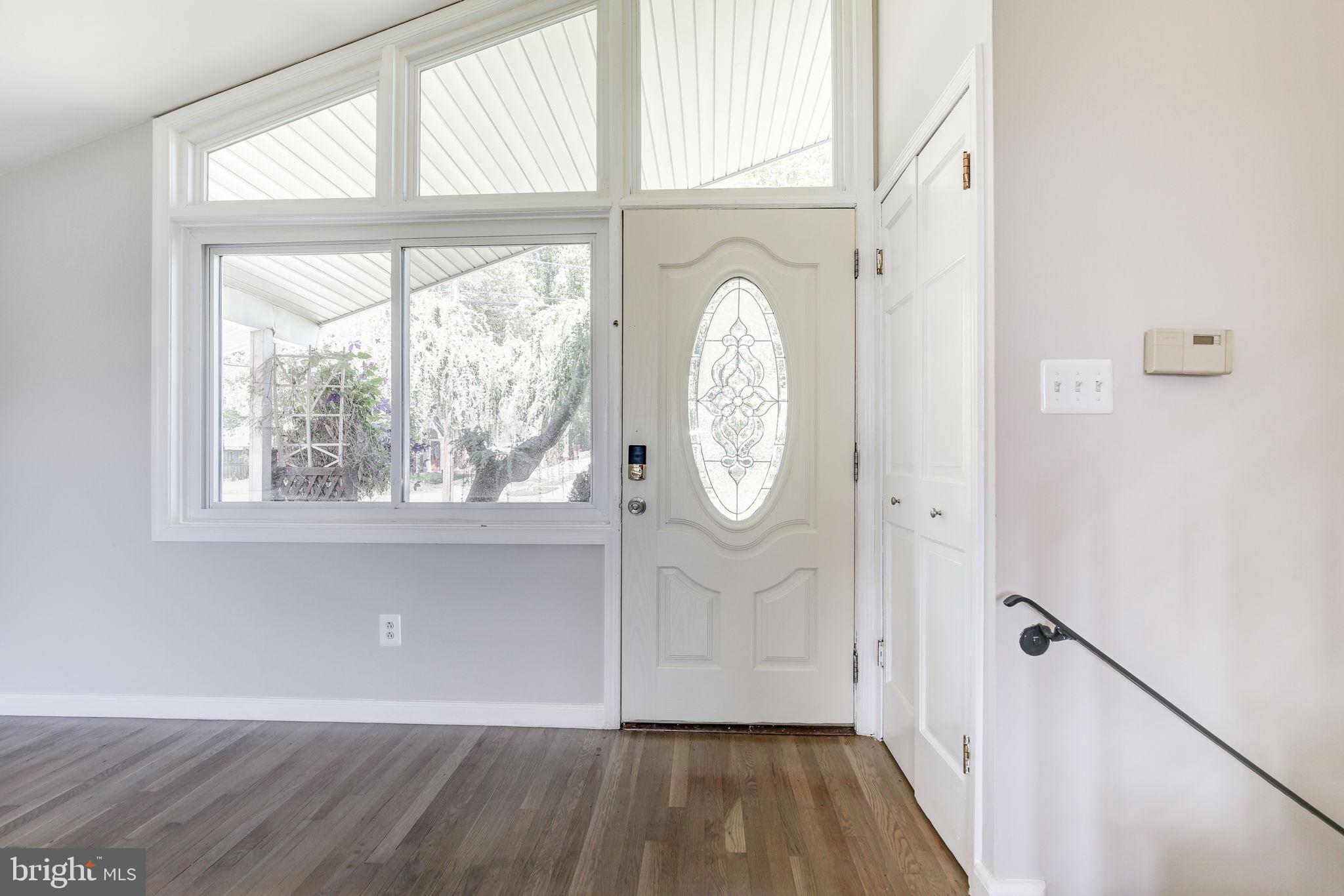 11830 Charles Road Silver Spring, MD 20906 - Photo 3 of 54 a view of a room with wooden floor and window