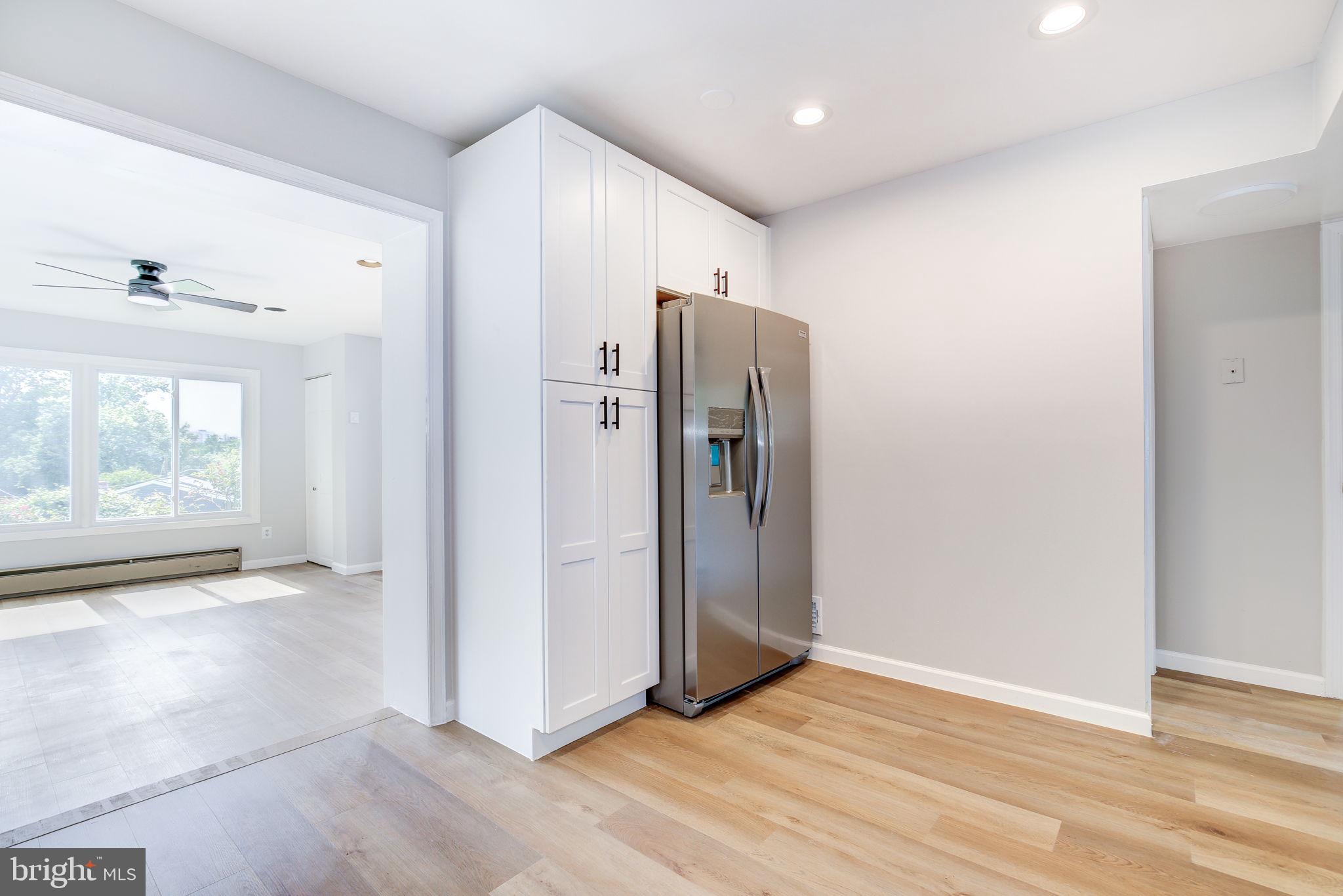 11830 Charles Road Silver Spring, MD 20906 - Photo 32 of 54 a view of an empty room with wooden floor and a window