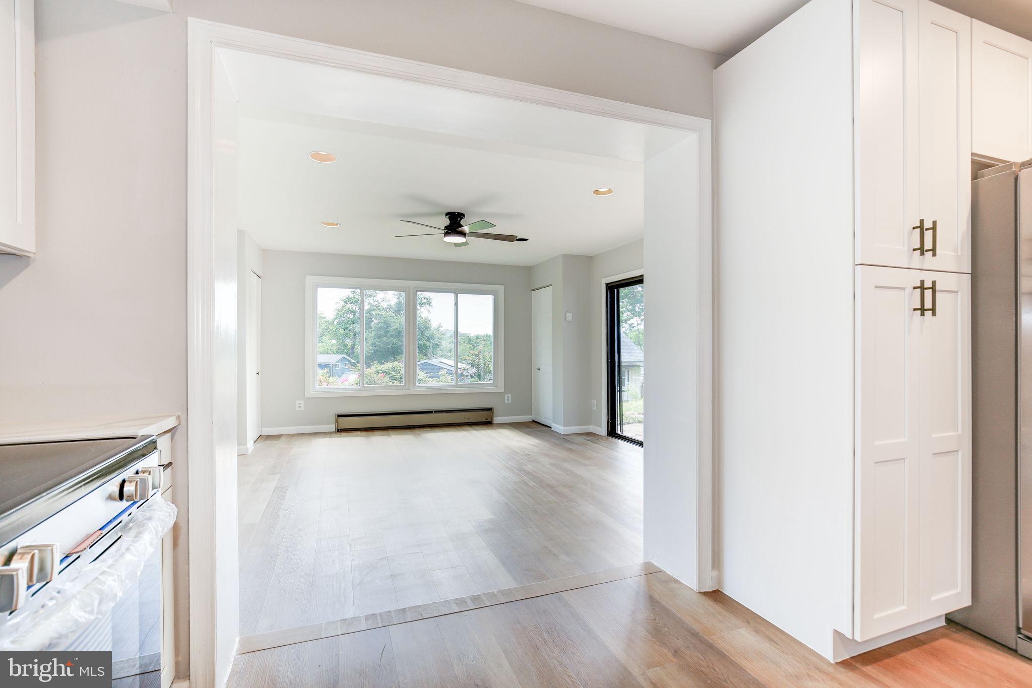 11830 Charles Road Silver Spring, MD 20906 - Photo 34 of 54 a view of an empty room with wooden floor and a window
