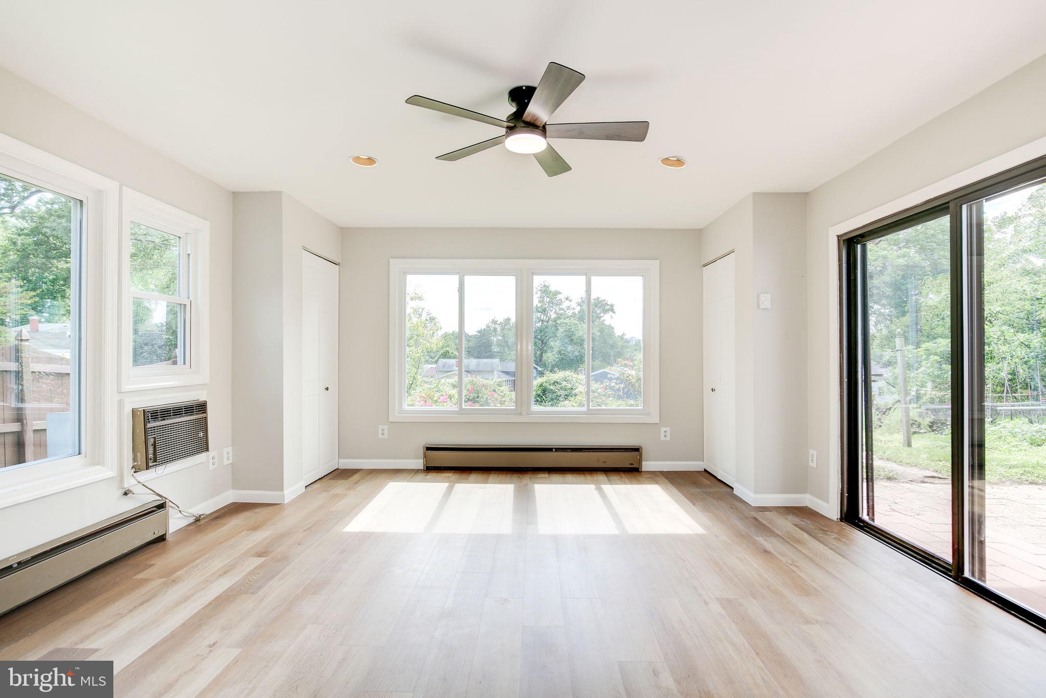 11830 Charles Road Silver Spring, MD 20906 - Photo 35 of 54 a view of empty room with wooden floor and fan