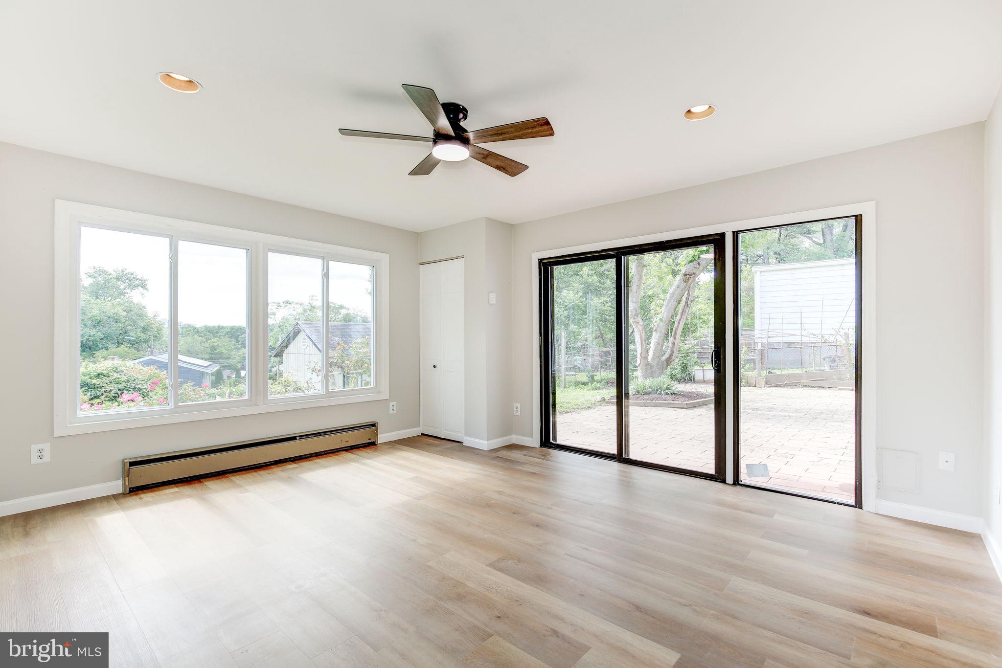 11830 Charles Road Silver Spring, MD 20906 - Photo 36 of 54 wooden floor in an empty room with a window