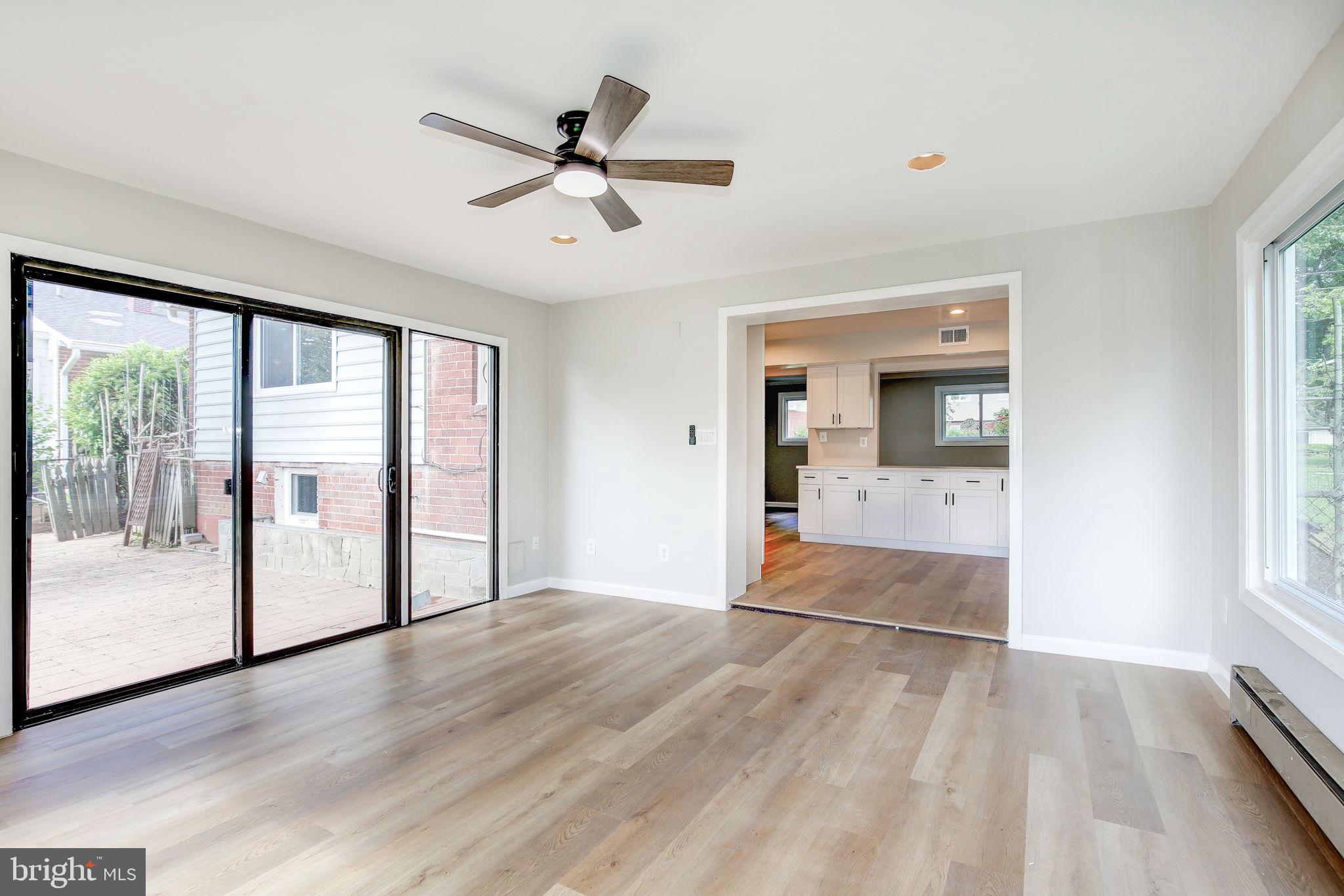 11830 Charles Road Silver Spring, MD 20906 - Photo 37 of 54 a view of empty room with wooden floor and fan