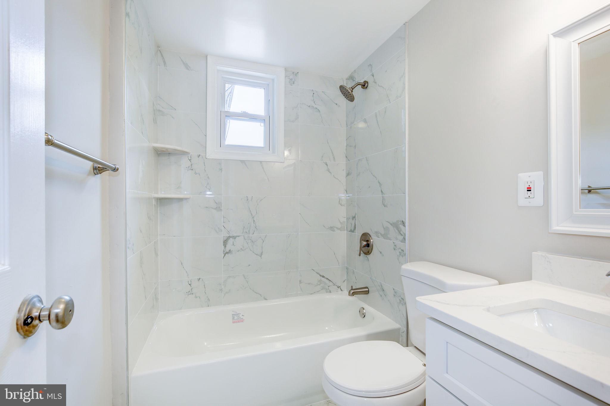 11830 Charles Road Silver Spring, MD 20906 - Photo 40 of 54 a bathroom with a sink toilet and bathtub