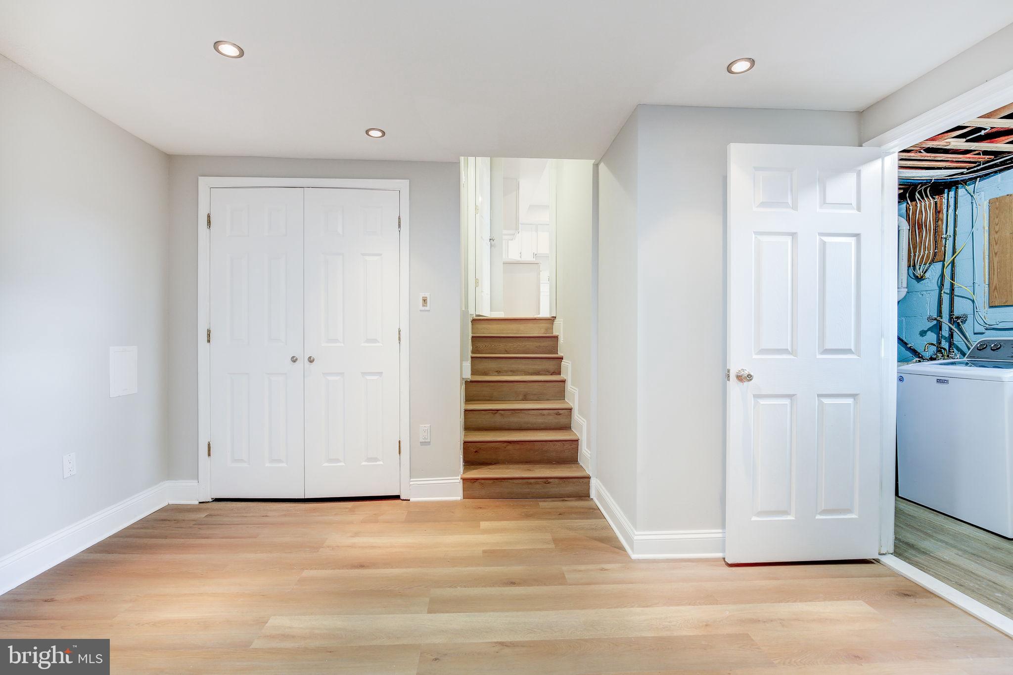 11830 Charles Road Silver Spring, MD 20906 - Photo 41 of 54 a view of a hallway with wooden floor and entryway