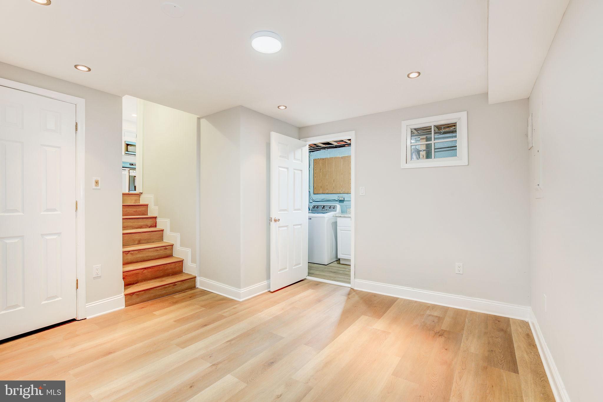 11830 Charles Road Silver Spring, MD 20906 - Photo 42 of 54 a view of a livingroom with wooden floor and stairs