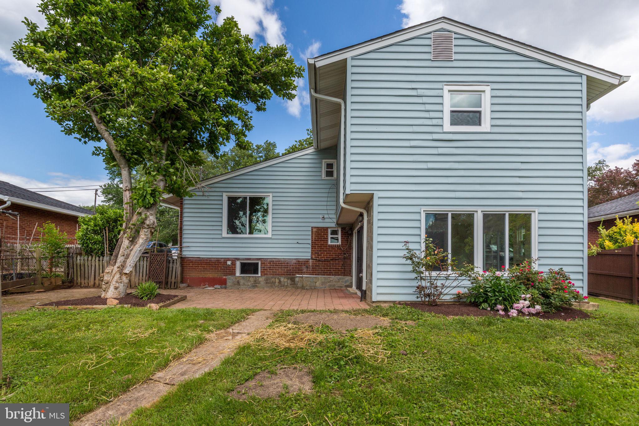 11830 Charles Road Silver Spring, MD 20906 - Photo 44 of 54 a front view of house with a garden