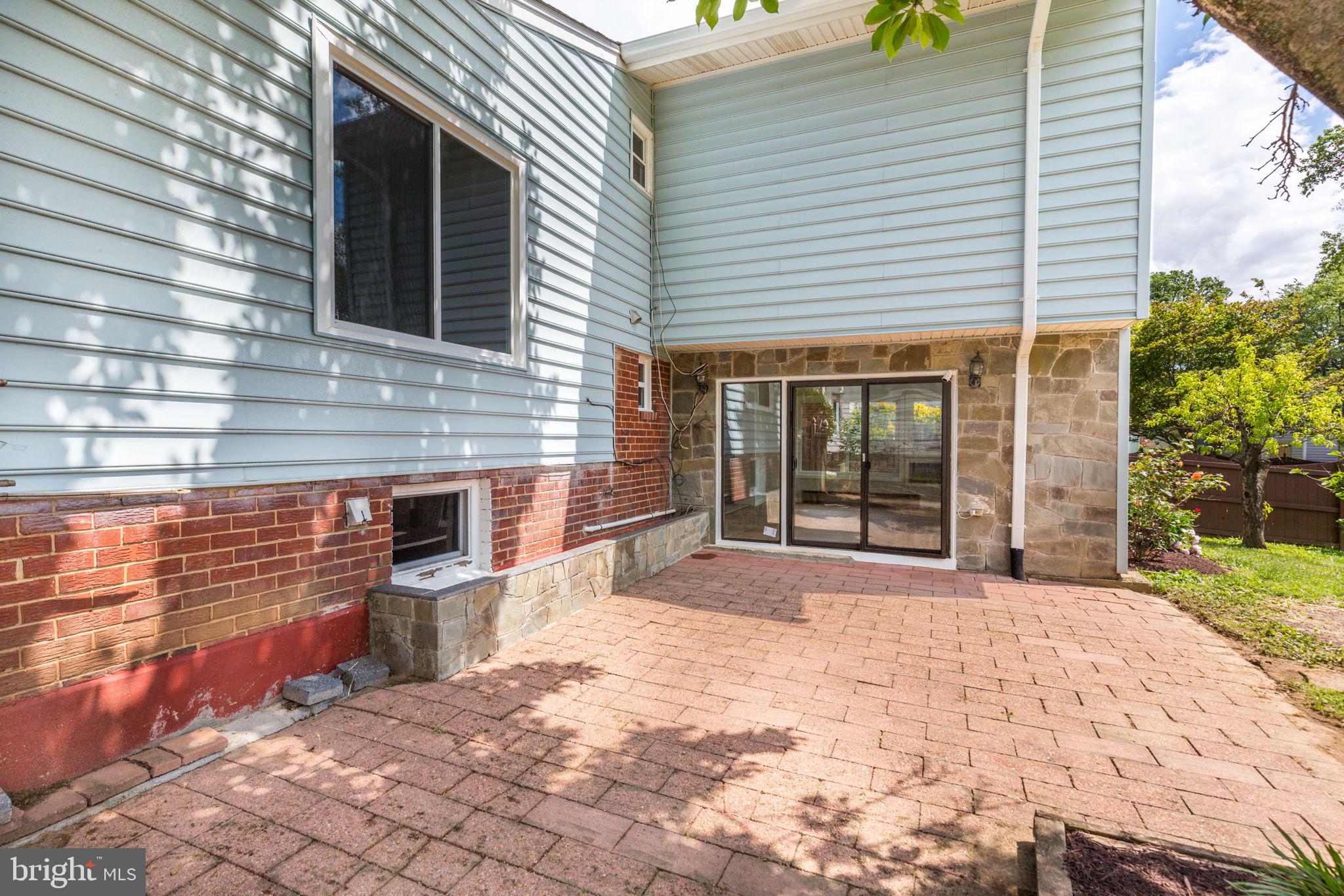 11830 Charles Road Silver Spring, MD 20906 - Photo 46 of 54 a view of a lounge chairs in the back yard of the house