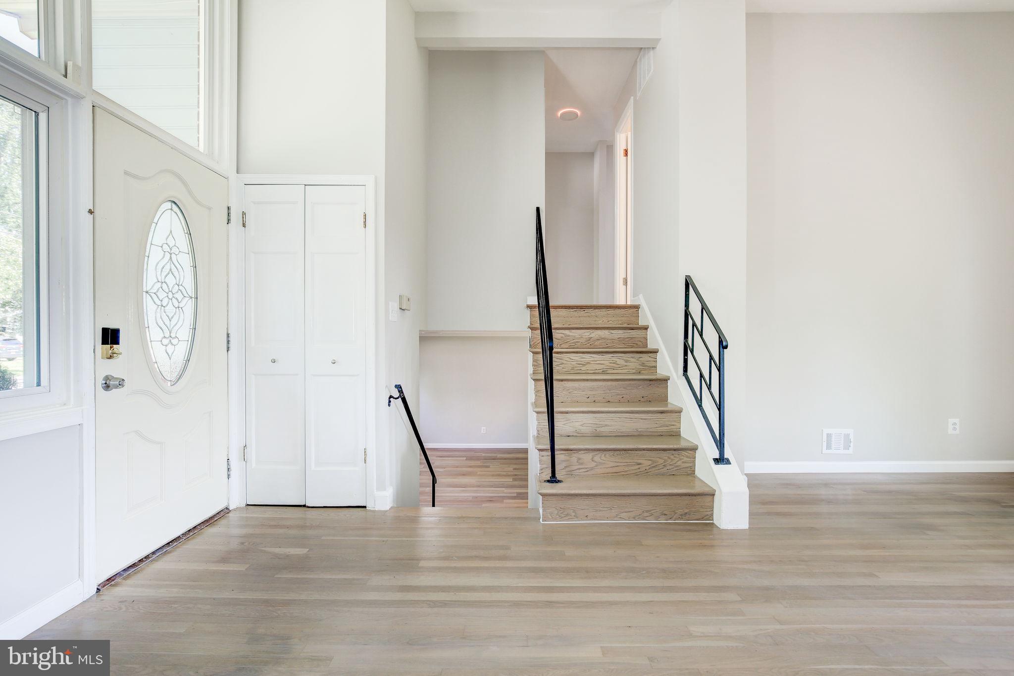 11830 Charles Road Silver Spring, MD 20906 - Photo 7 of 54 a view of entryway and hall with wooden floor