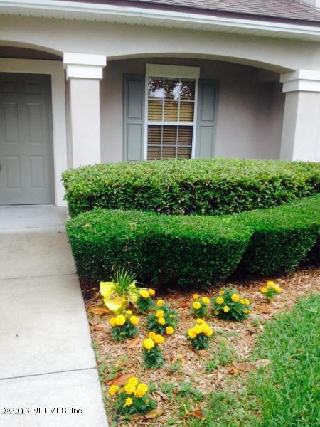 1816 Cross Pines Drive Fleming Island, FL 32003 - Photo 2 of 13 a view of a house with a yard